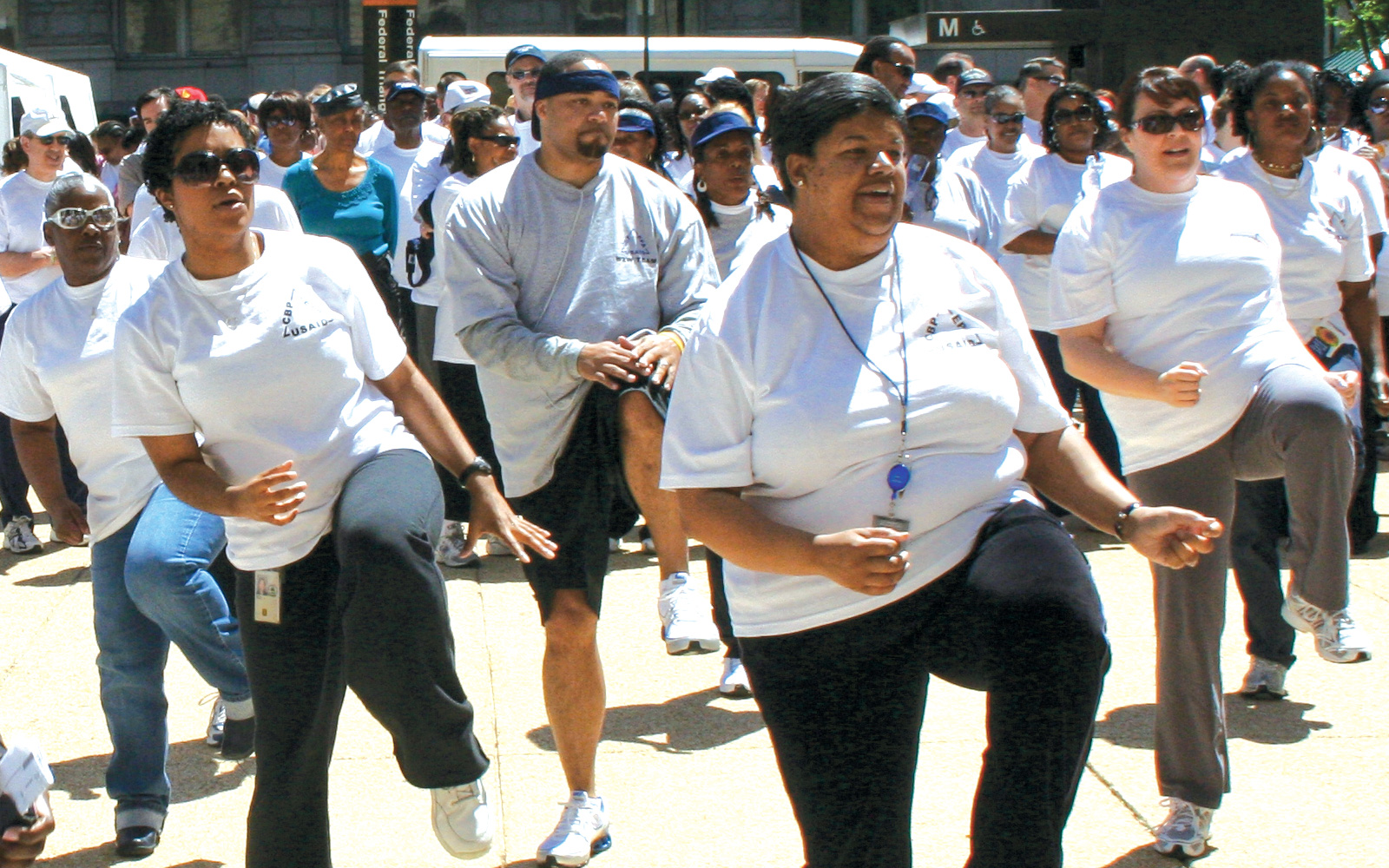 EPA employees partaking in synchronized outdoor aerobic activity