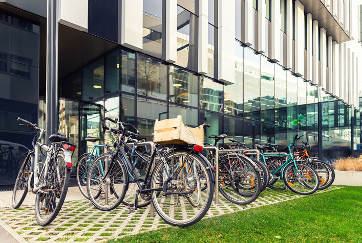photo of bicycles parked outside an office building