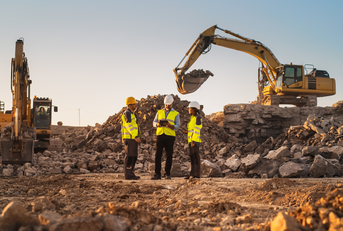 photo of construction site with foreman and excavators 